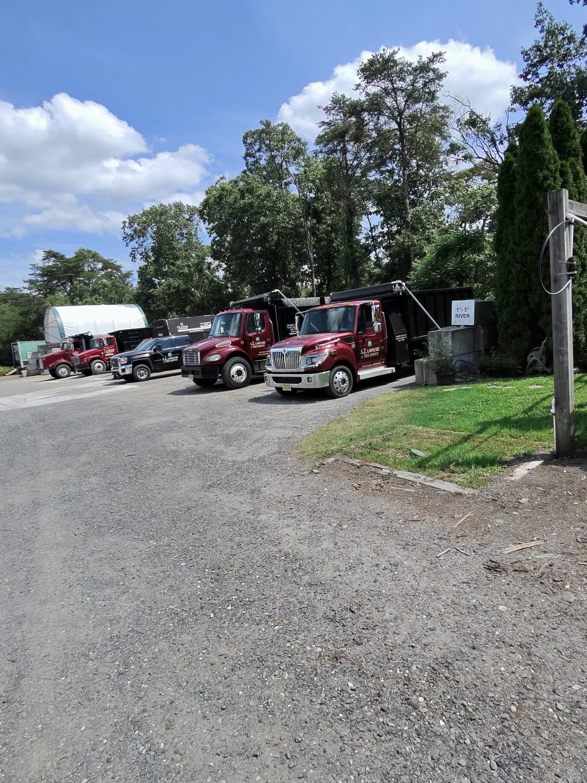 A.Z. delivery fleet showing multiple truck sizes at the Tabernacle yard