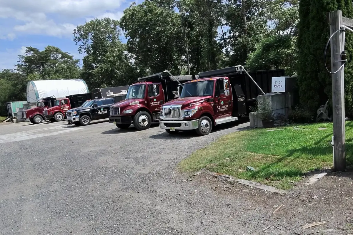 Three sizes of A.Z. delivery dump trucks at the Tabernacle yard