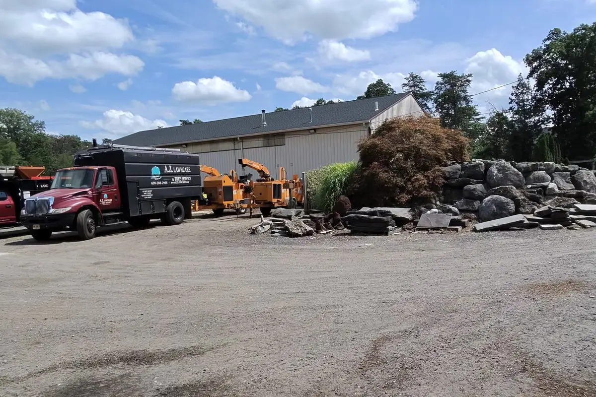 A.Z. tree-service and delivery trucks parked at the Route 206 supply yard